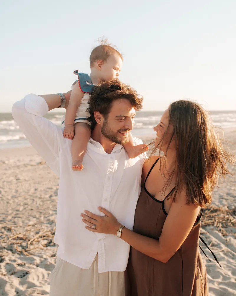 Zach Zedalis with his wife and daughter on the beach